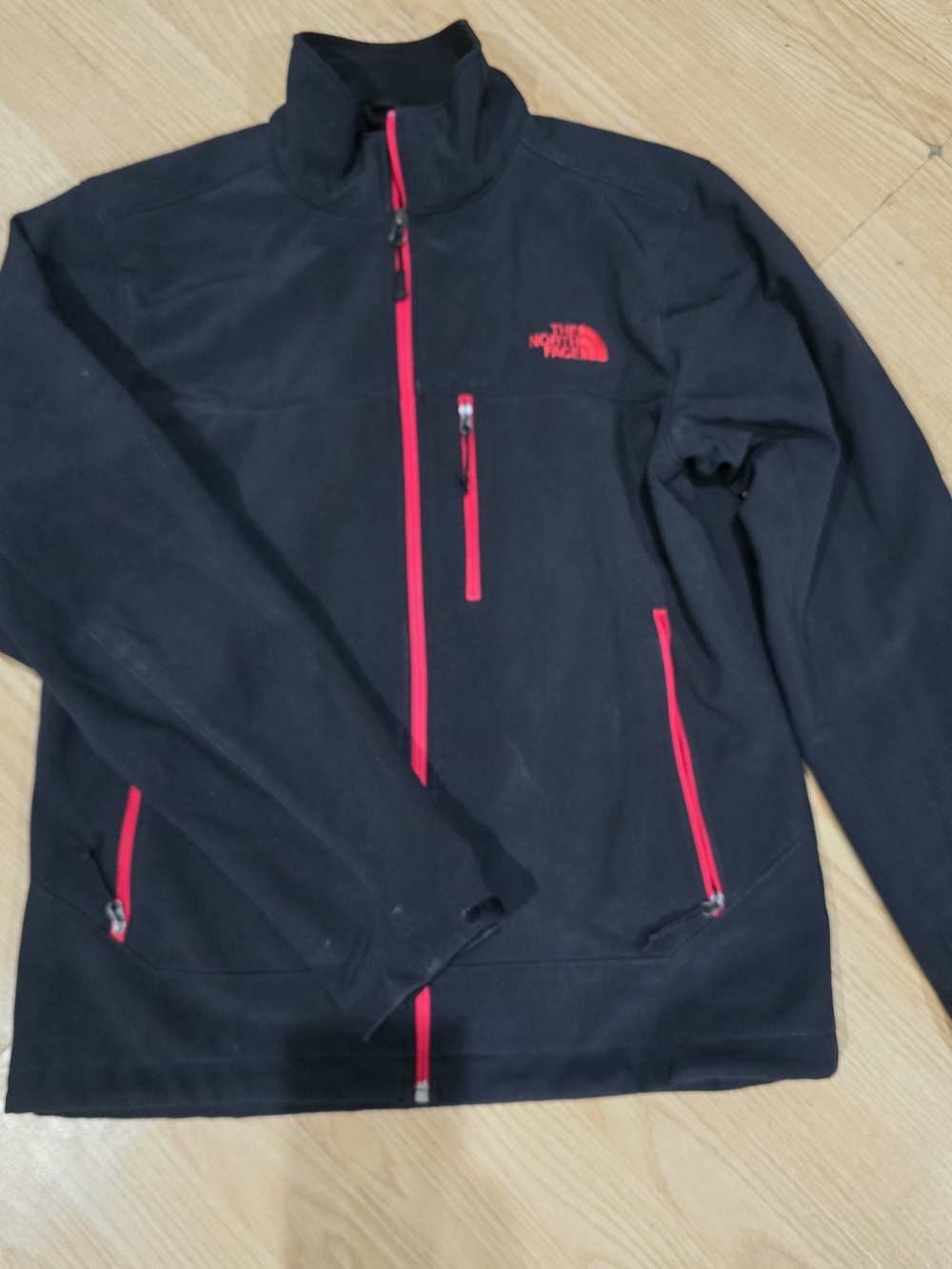The North Face Black Jacket with Red Zippers Size S.